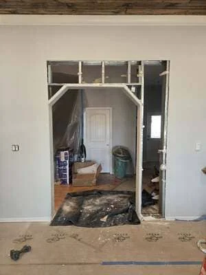 Rough framed doorway opening with header and studs, interior wall construction